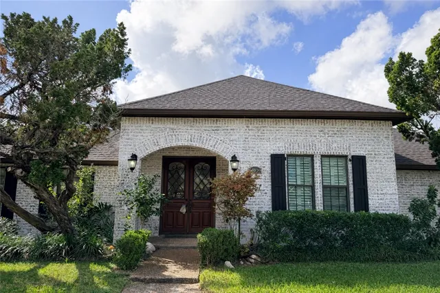 a view of a chandelier in a room with wooden floor