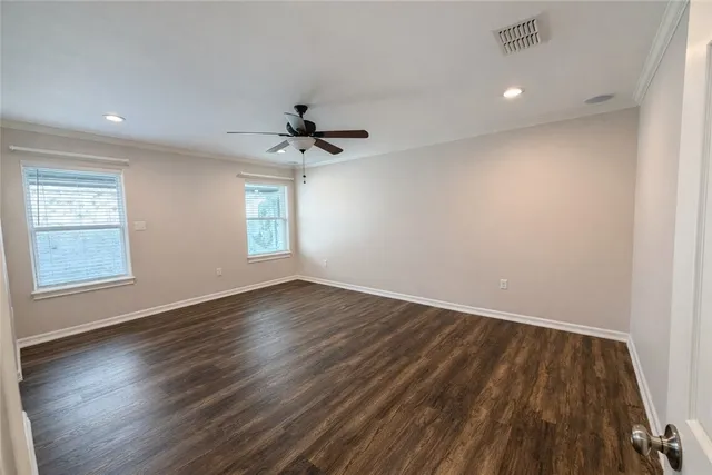 a bathroom with a sink shower and a mirror