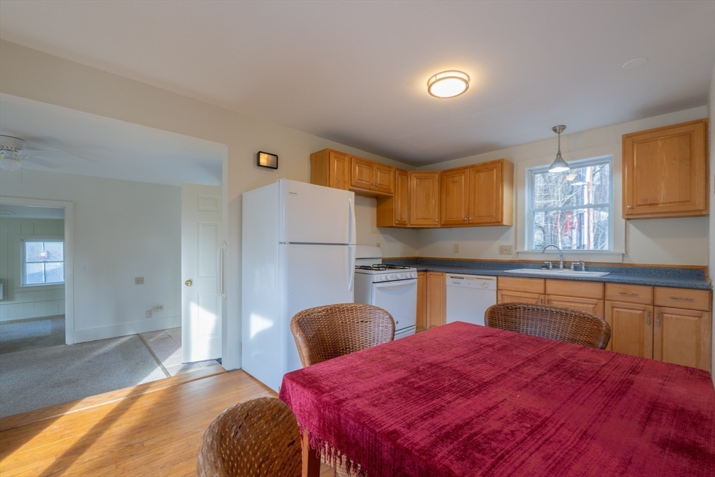 7 Depot Road Williamsburg, MA 01039 - Photo 12 of 29 a bedroom with a bed and a view of kitchen