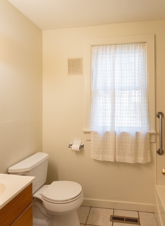 7 Depot Road Williamsburg, MA 01039 - Photo 15 of 29 a white toilet sitting next to a window and a shower