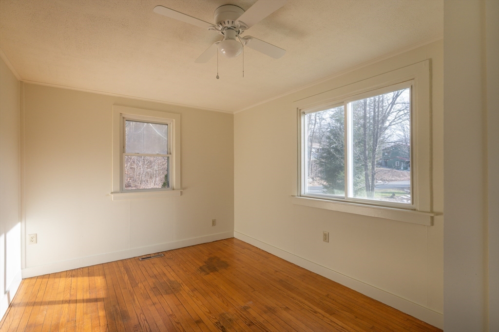7 Depot Road Williamsburg, MA 01039 - Photo 16 of 29 a view of an empty room with wooden floor and a window
