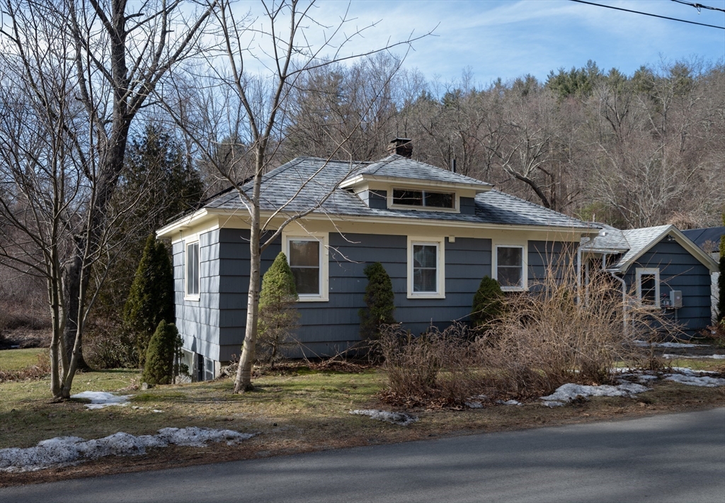 7 Depot Road Williamsburg, MA 01039 - Photo 2 of 29 a front view of a house with a yard