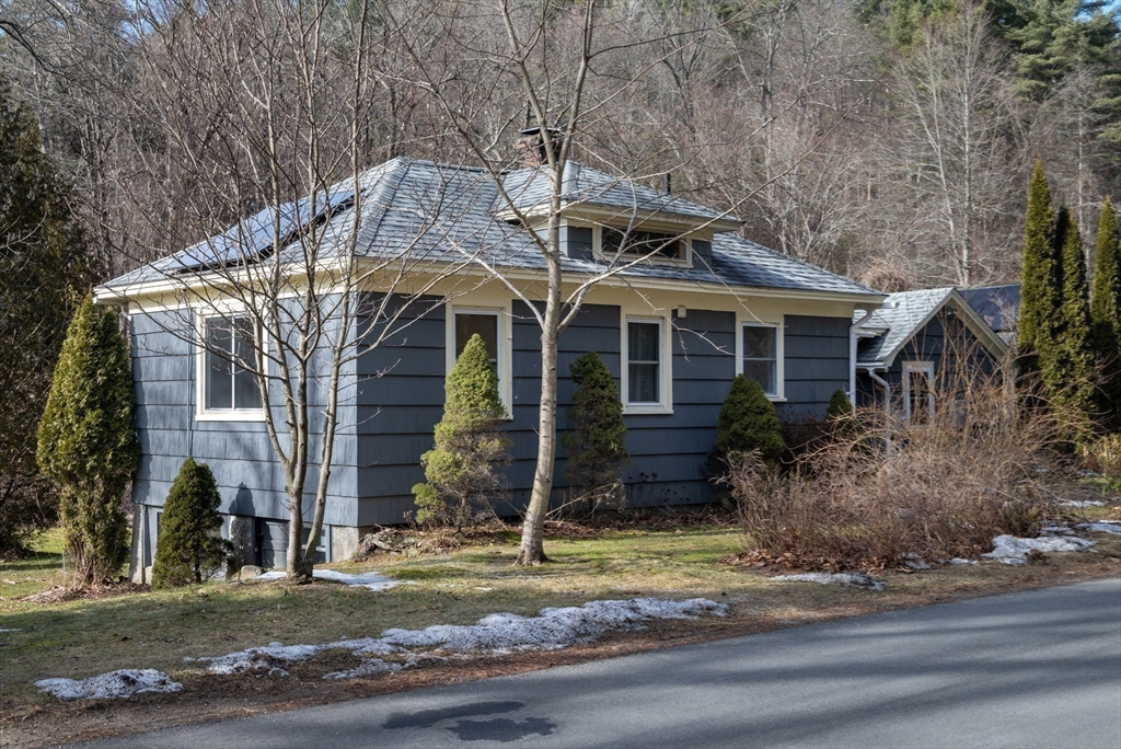 7 Depot Road Williamsburg, MA 01039 - Photo 25 of 29 a front view of a house with a yard
