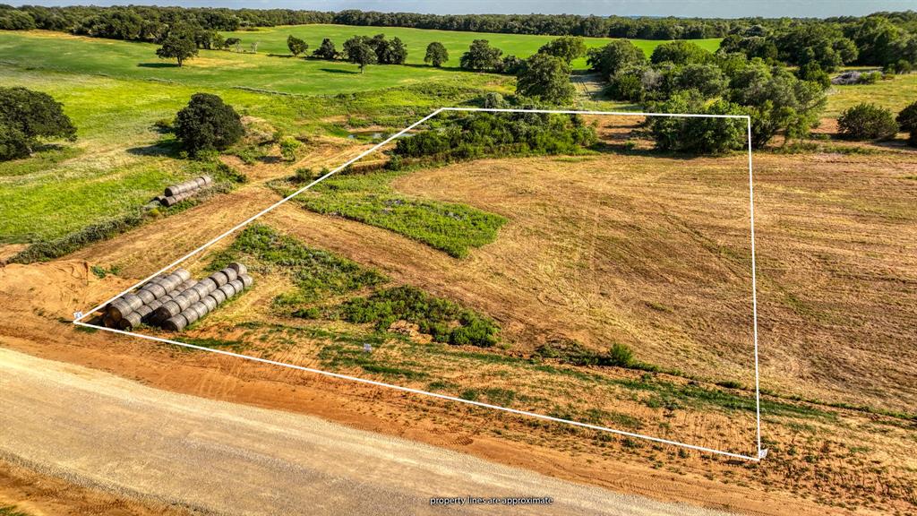 Lot 13-14 Three Quarter Loop Poolville, TX 76487 - Photo 3 of 10 a view of a tennis court