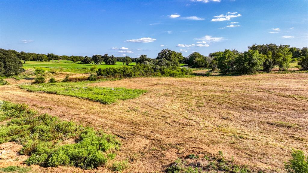 Lot 13-14 Three Quarter Loop Poolville, TX 76487 - Photo 7 of 10 a view of an outdoor space and a yard