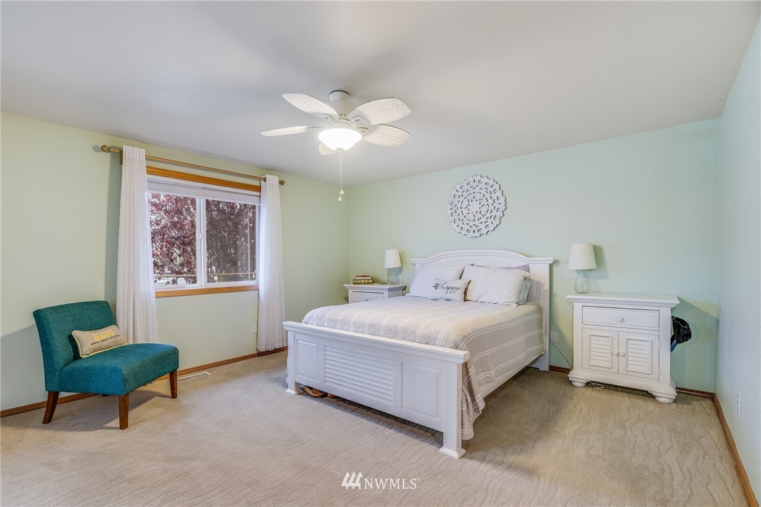 151 Jackson View Drive Chehalis, WA 98532 - Photo 14 of 31 a bedroom with a bed and a chair
