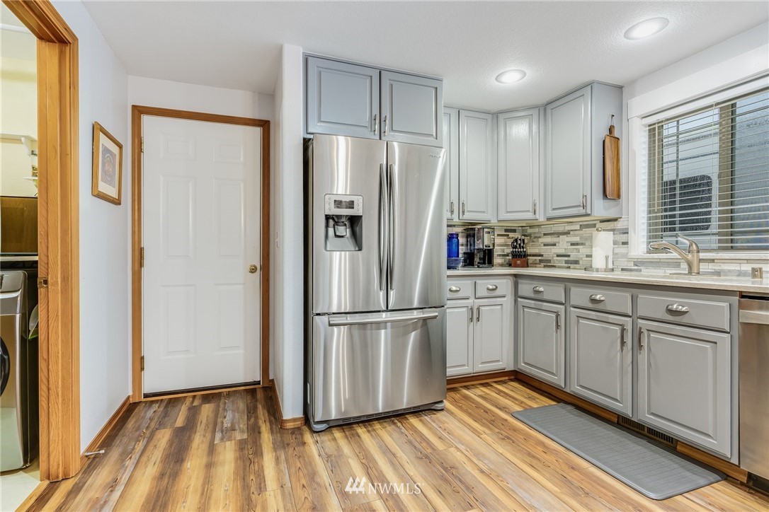 151 Jackson View Drive Chehalis, WA 98532 - Photo 8 of 31 a kitchen with stainless steel appliances a refrigerator sink and cabinets