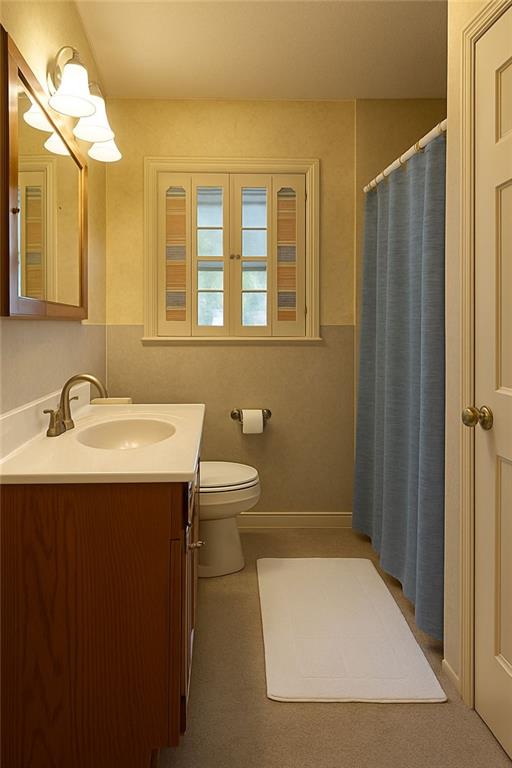 116 Mt Calvary Road Marietta, GA 30064 - Photo 13 of 31 a bathroom with a sink and mirror
