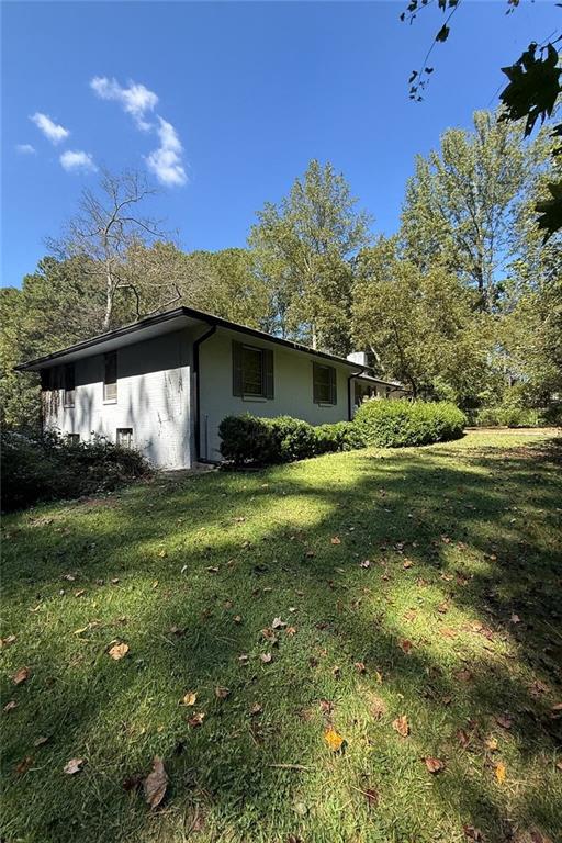 116 Mt Calvary Road Marietta, GA 30064 - Photo 16 of 31 a front view of a house with garden