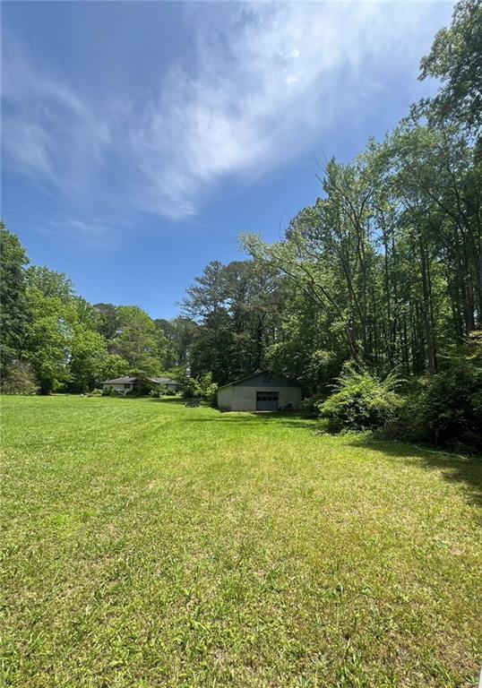 116 Mt Calvary Road Marietta, GA 30064 - Photo 19 of 31 a view of a field with a tree in the background