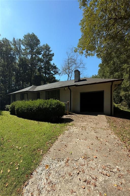 116 Mt Calvary Road Marietta, GA 30064 - Photo 2 of 31 a front view of a house with a yard