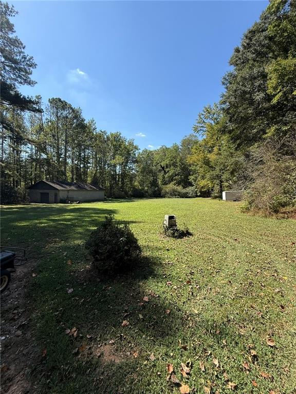 116 Mt Calvary Road Marietta, GA 30064 - Photo 25 of 31 a view of a green field with wooden fence