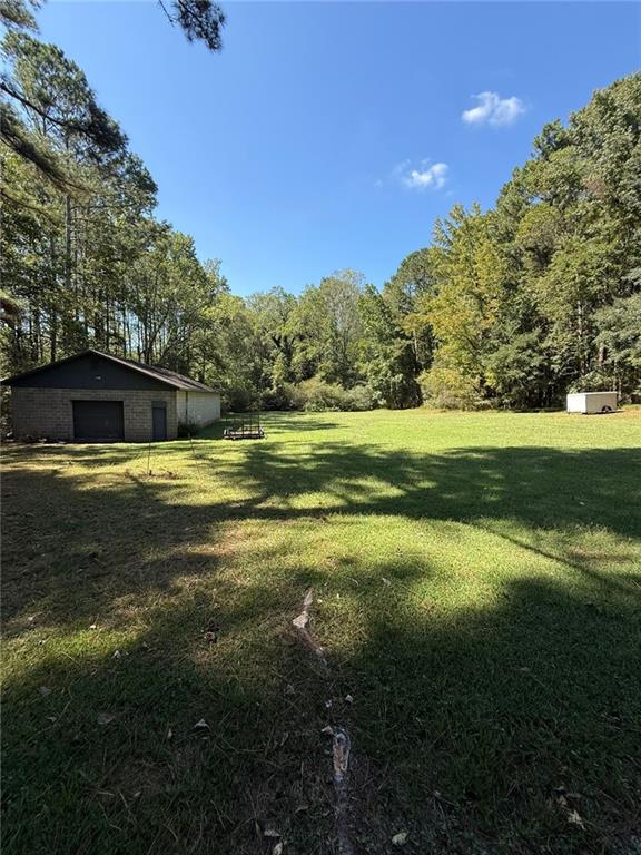 116 Mt Calvary Road Marietta, GA 30064 - Photo 31 of 31 a view of a swimming pool with an outdoor space and seating area