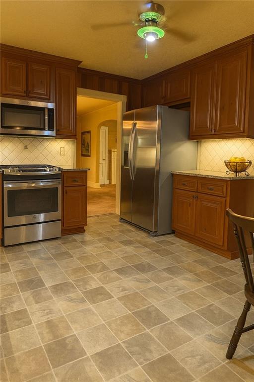 116 Mt Calvary Road Marietta, GA 30064 - Photo 4 of 31 a kitchen with granite countertop a stove cabinets and stainless steel appliances