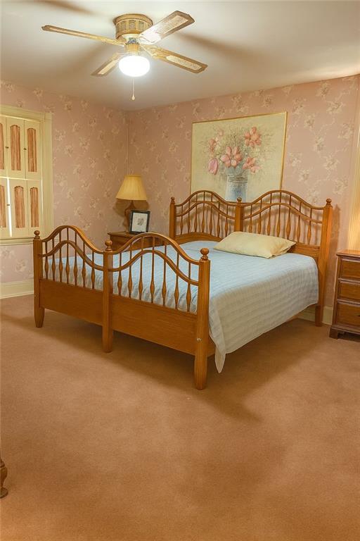 116 Mt Calvary Road Marietta, GA 30064 - Photo 7 of 31 a spacious bedroom with a bed and a chandelier