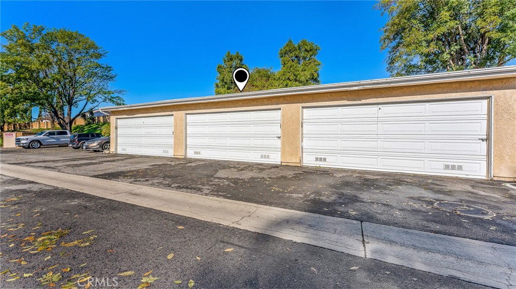 2915 Deacon Street, Unit 17 Simi Valley, CA 93065 - Photo 4 of 43 a view of a house with a window and floor to ceiling window and trees