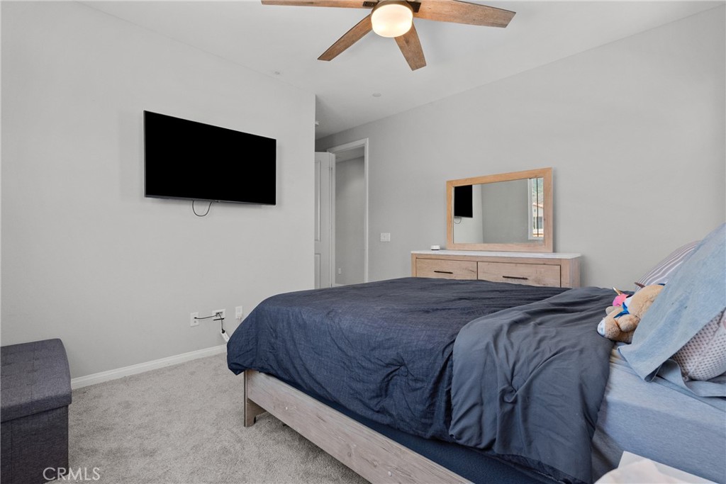 232 River Street Fillmore, CA 93015 - Photo 36 of 61 a bedroom with a bed and a flat screen tv