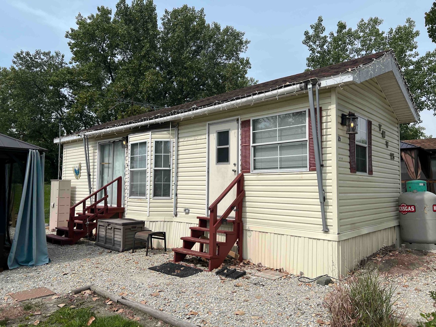 25 Dinosaur Road Wilmington, IL 60481 - Photo 1 of 10 a view of a house with a backyard and chairs