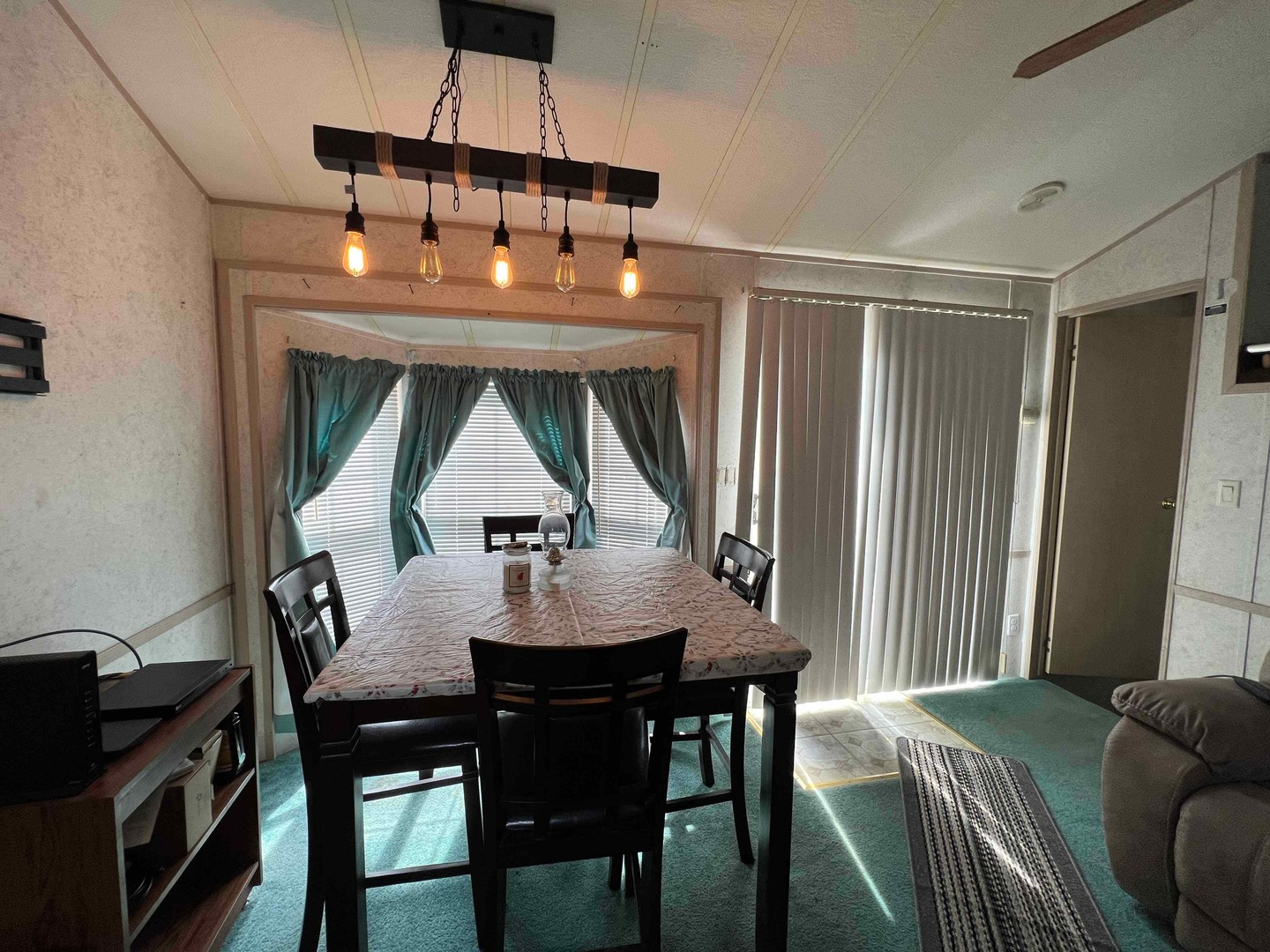 25 Dinosaur Road Wilmington, IL 60481 - Photo 4 of 10 a view of a dining room with furniture and wooden floor