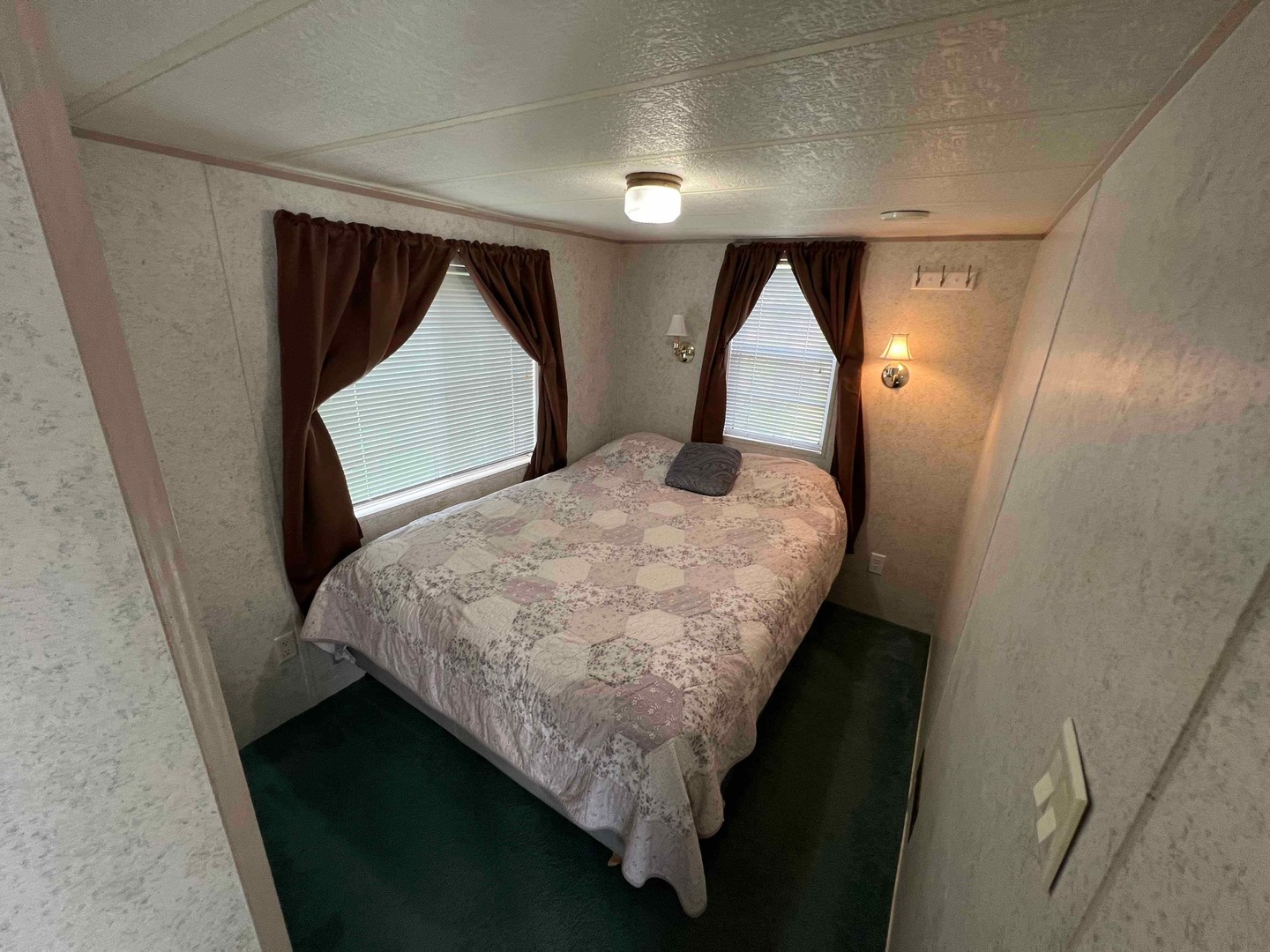 25 Dinosaur Road Wilmington, IL 60481 - Photo 6 of 10 a bed sitting in a bedroom next to a window