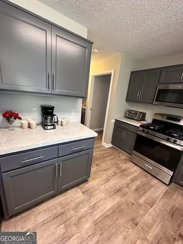 a room with a bed and a television