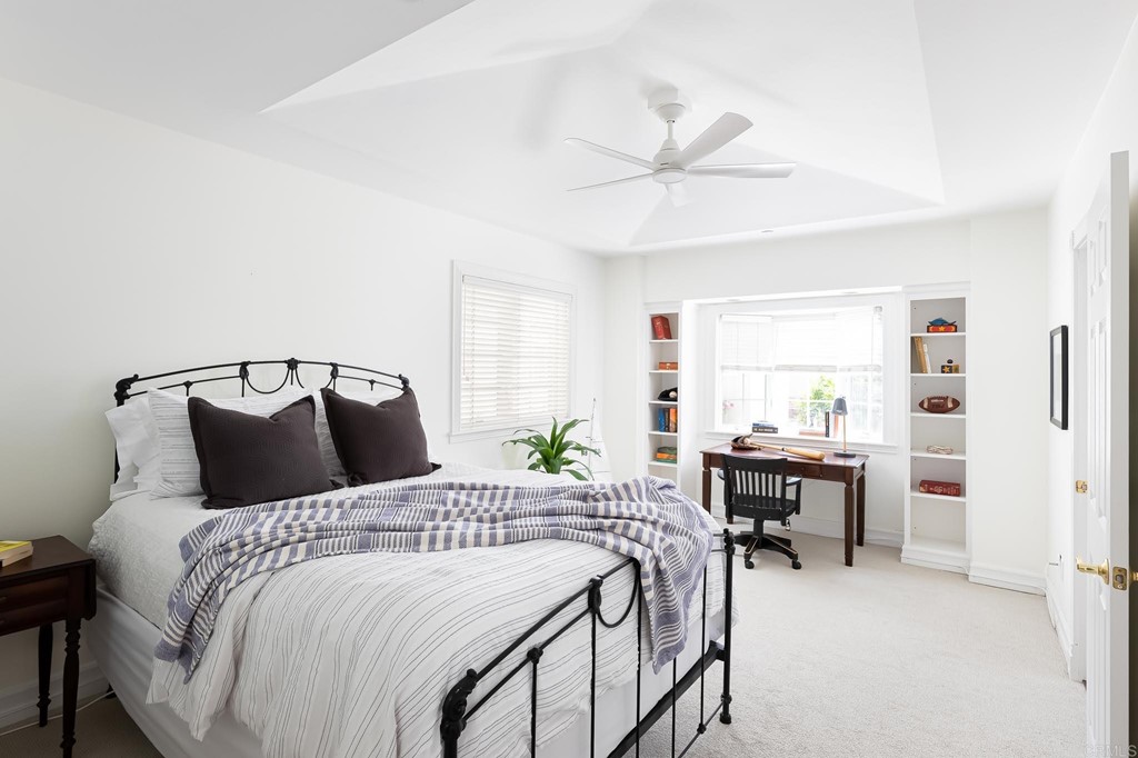 710 Cole Ranch Road Encinitas, CA 92024 - Photo 29 of 51 a bedroom with a bed and a chandelier