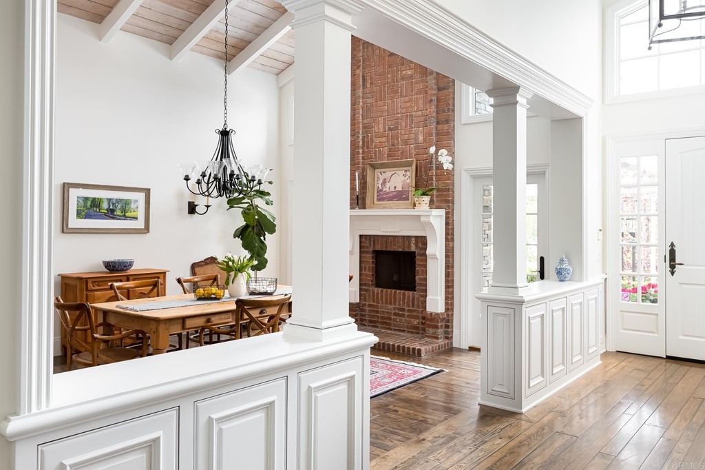 710 Cole Ranch Road Encinitas, CA 92024 - Photo 9 of 51 a living room with furniture a fireplace and a chandelier