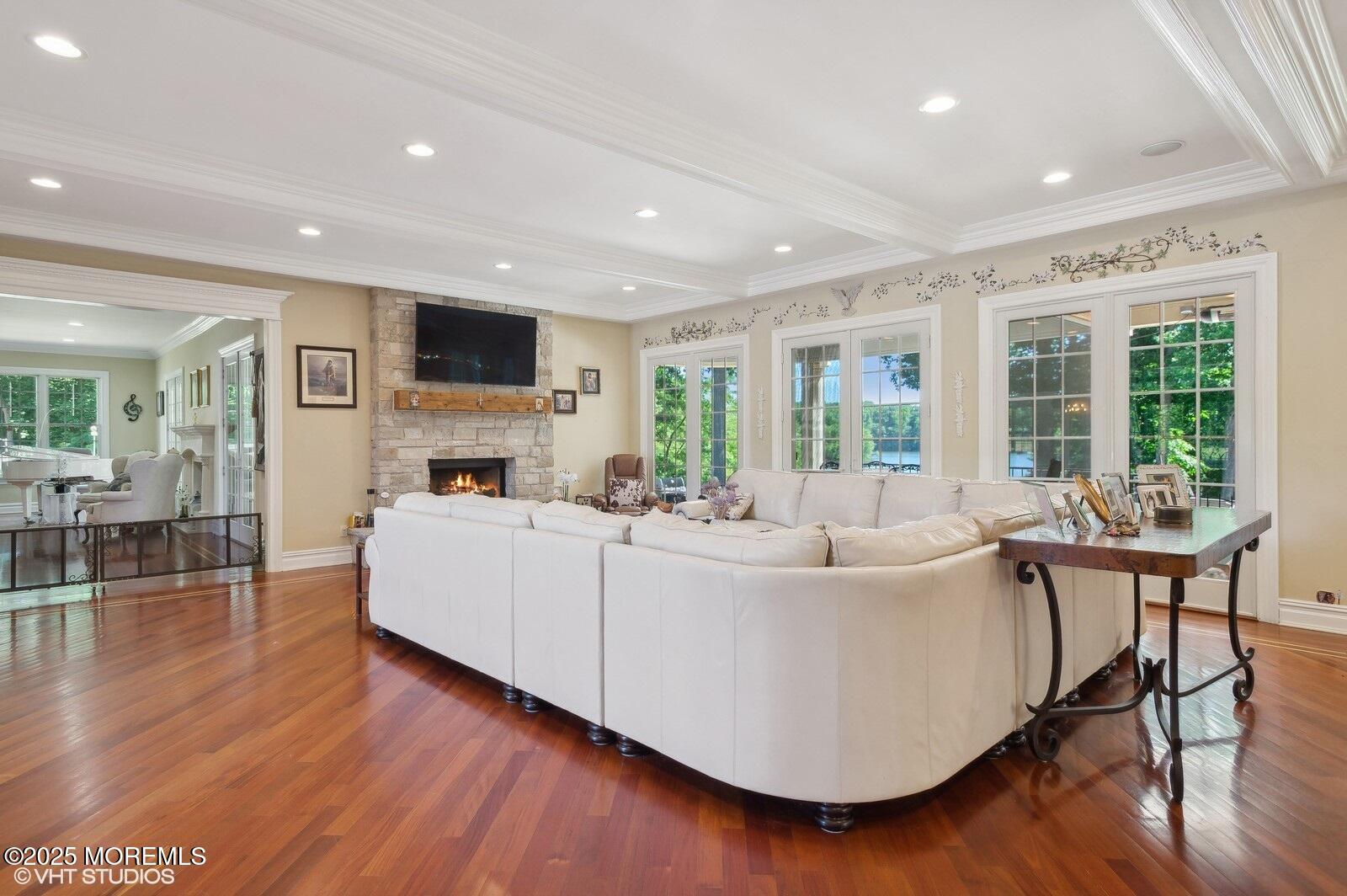 100 Richdale Road Colts Neck, NJ 07722 - Photo 10 of 31 a living room with furniture a large window and wooden floor
