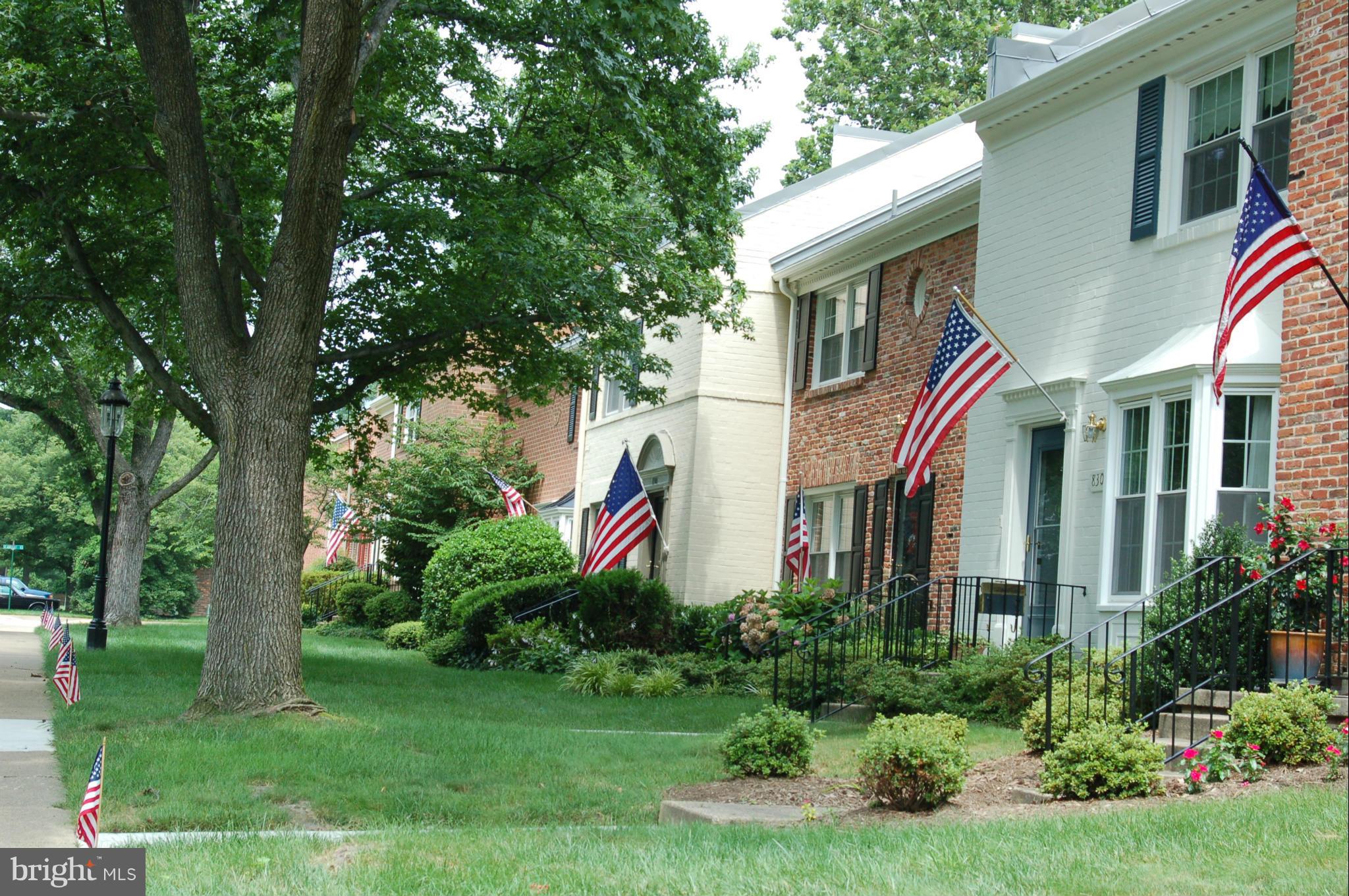 8306 Wickham Road Springfield, VA 22152 - Photo 2 of 29 a front view of a house with a yard and trees