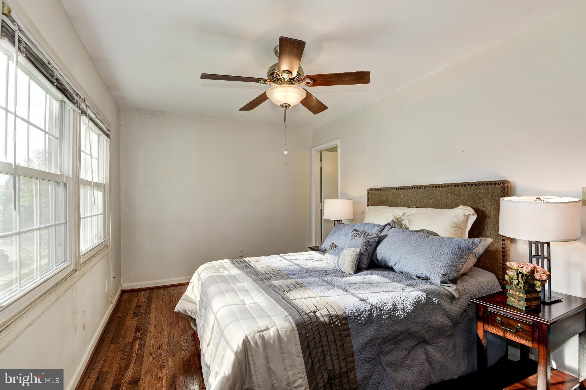 8306 Wickham Road Springfield, VA 22152 - Photo 14 of 29 a bedroom with a bed and a window