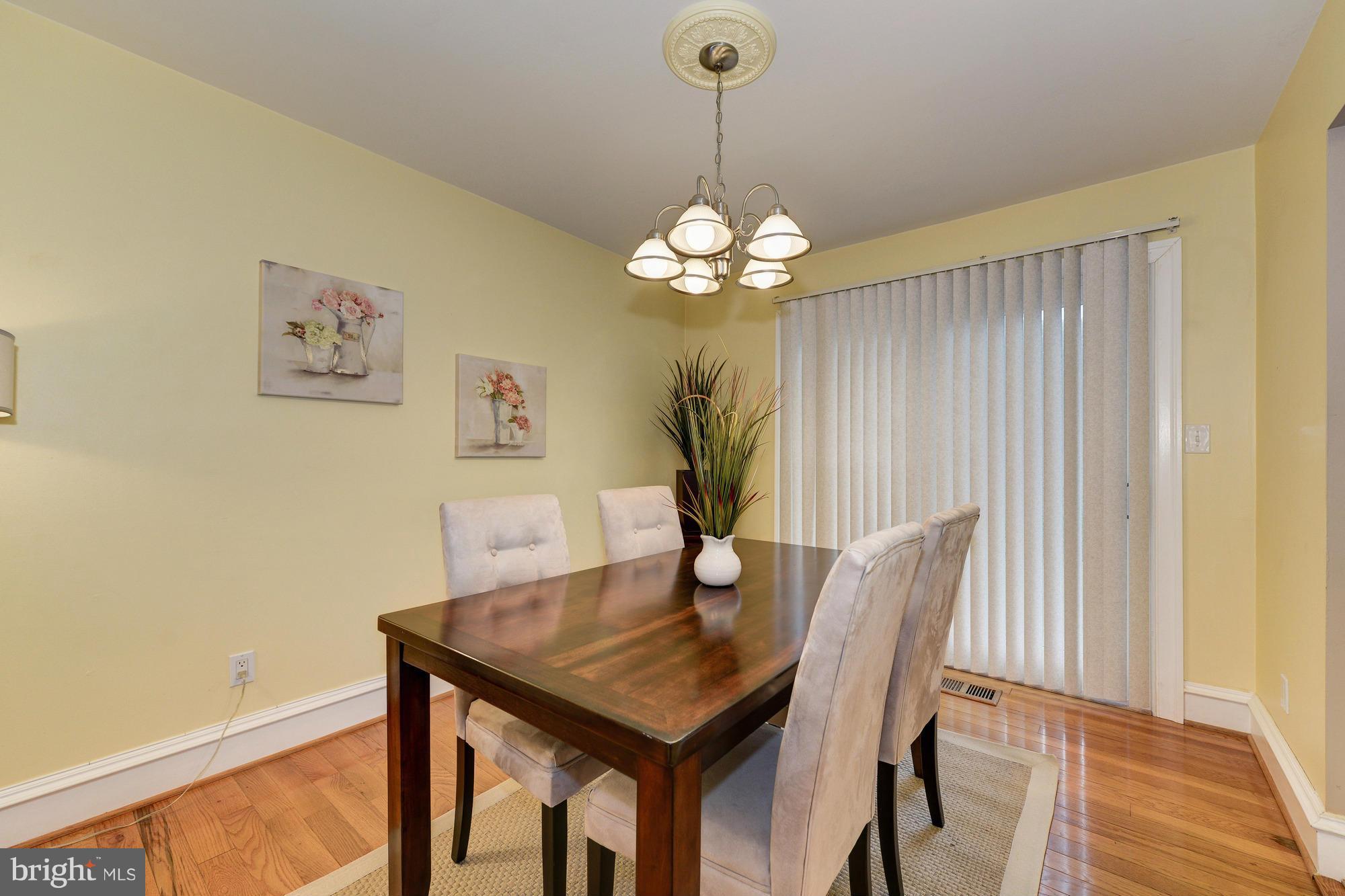 8306 Wickham Road Springfield, VA 22152 - Photo 6 of 29 a view of a dining room with a table and chairs