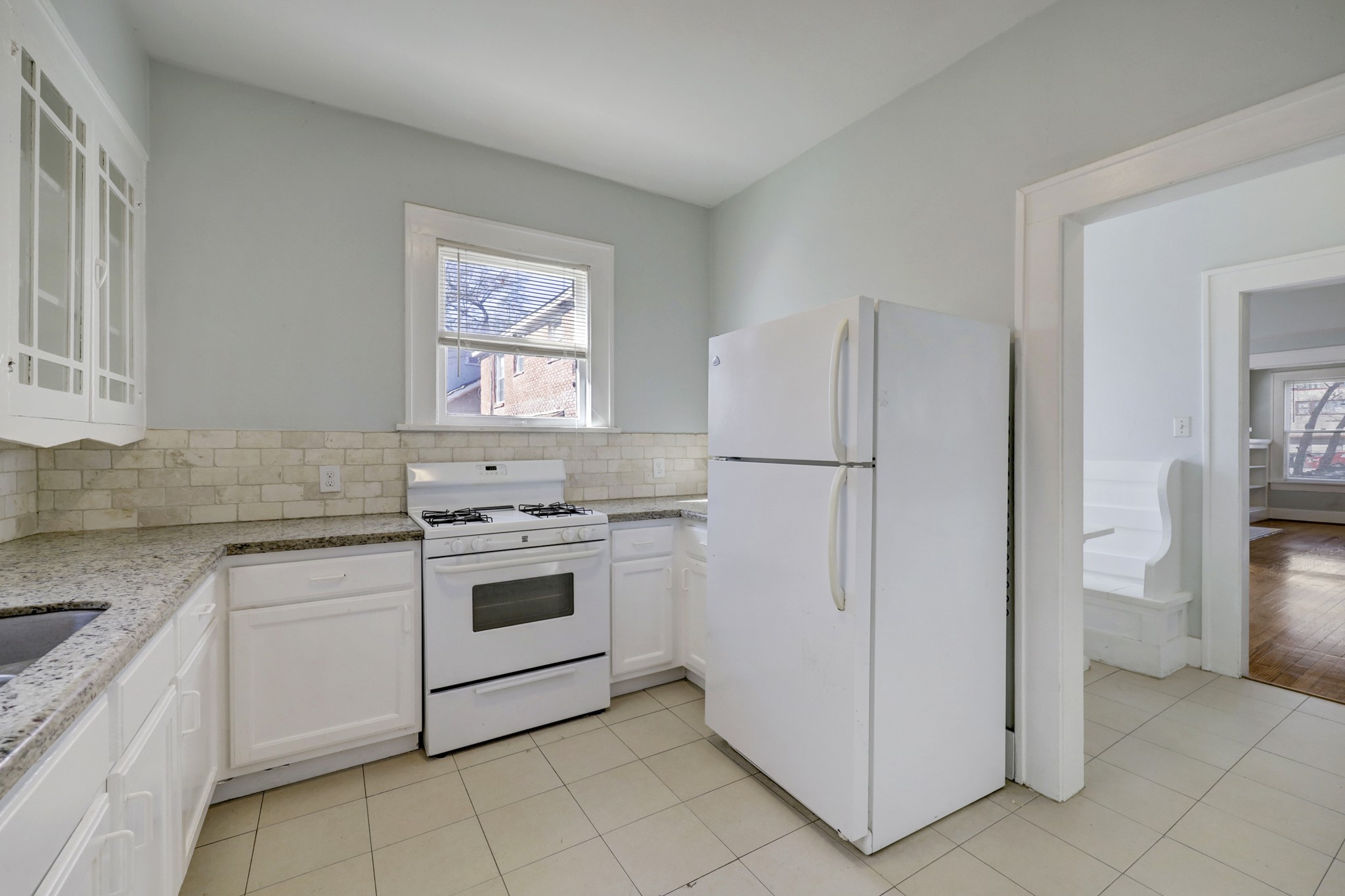 1649 West Main Street, Unit 3 Houston, TX 77006 - Photo 11 of 21 a kitchen with a stove a refrigerator and a sink