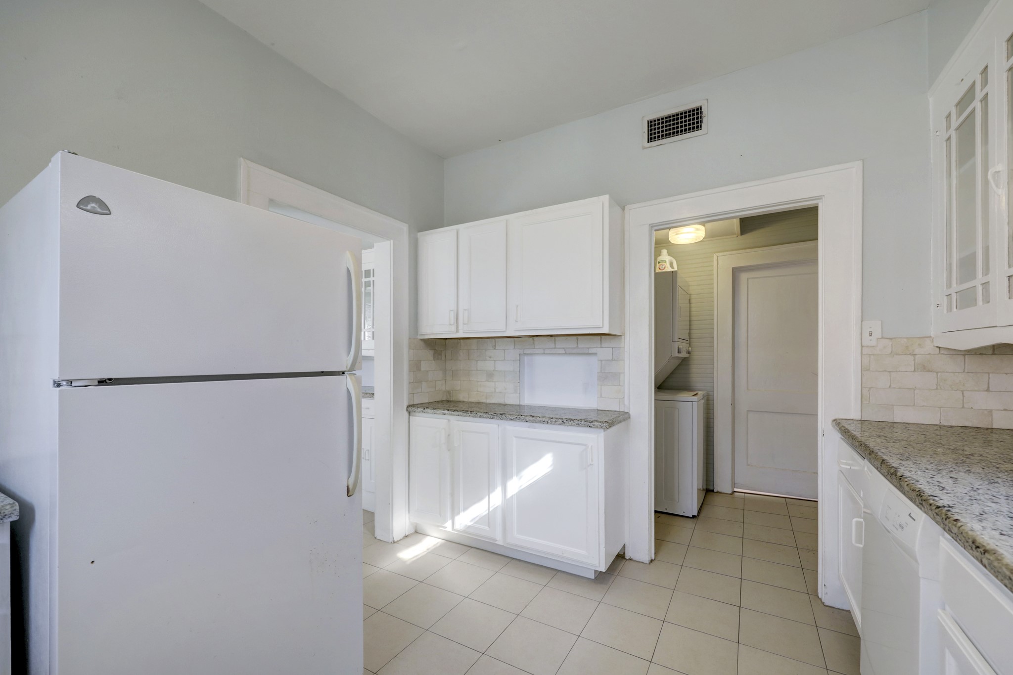 1649 West Main Street, Unit 3 Houston, TX 77006 - Photo 12 of 21 a kitchen with a refrigerator and a sink