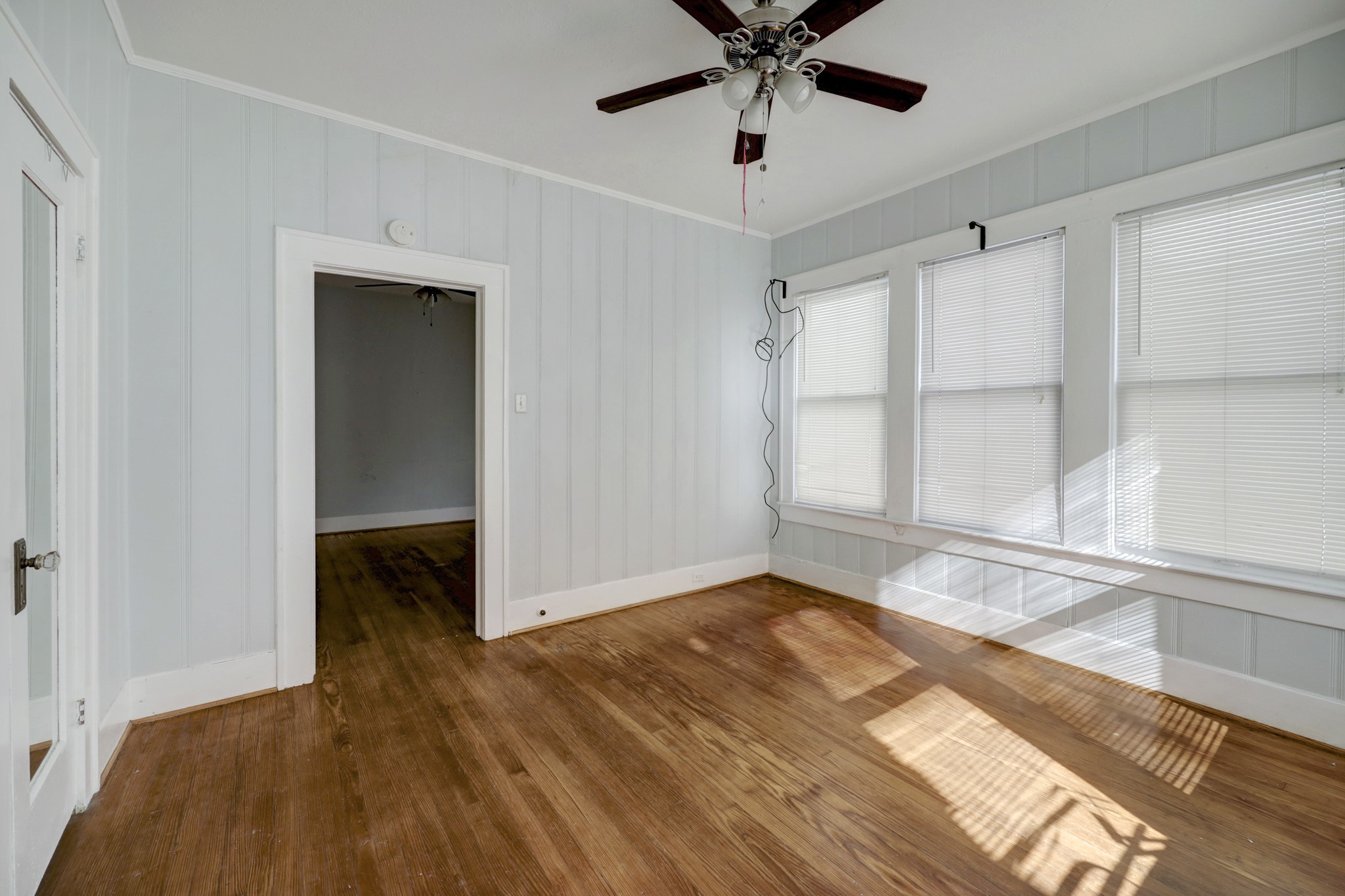 1649 West Main Street, Unit 3 Houston, TX 77006 - Photo 14 of 21 a view of empty room with wooden floor and fan