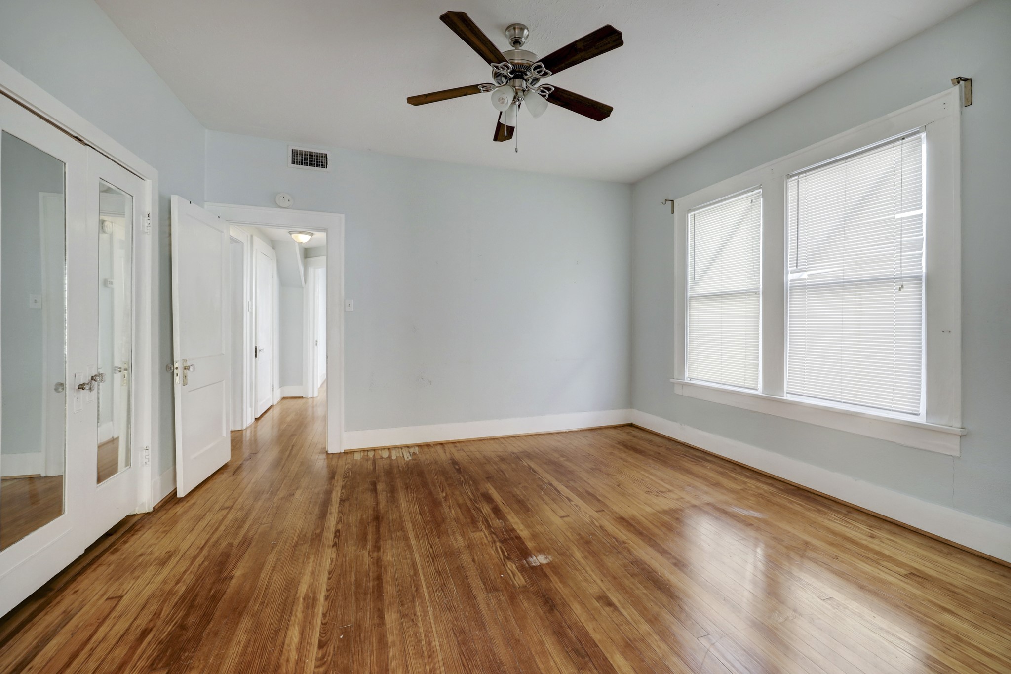 1649 West Main Street, Unit 3 Houston, TX 77006 - Photo 16 of 21 a view of empty room with wooden floor and fan