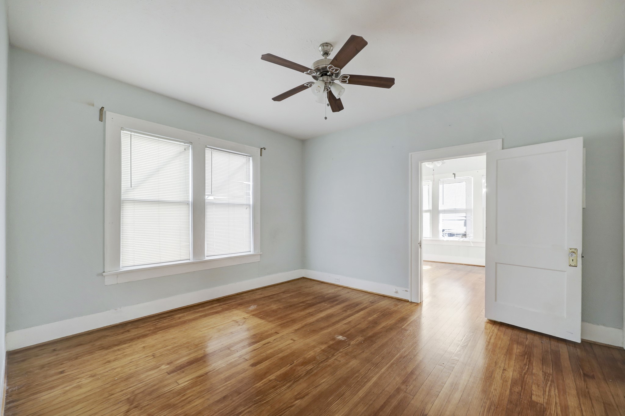 1649 West Main Street, Unit 3 Houston, TX 77006 - Photo 17 of 21 wooden floor in an empty room with a window