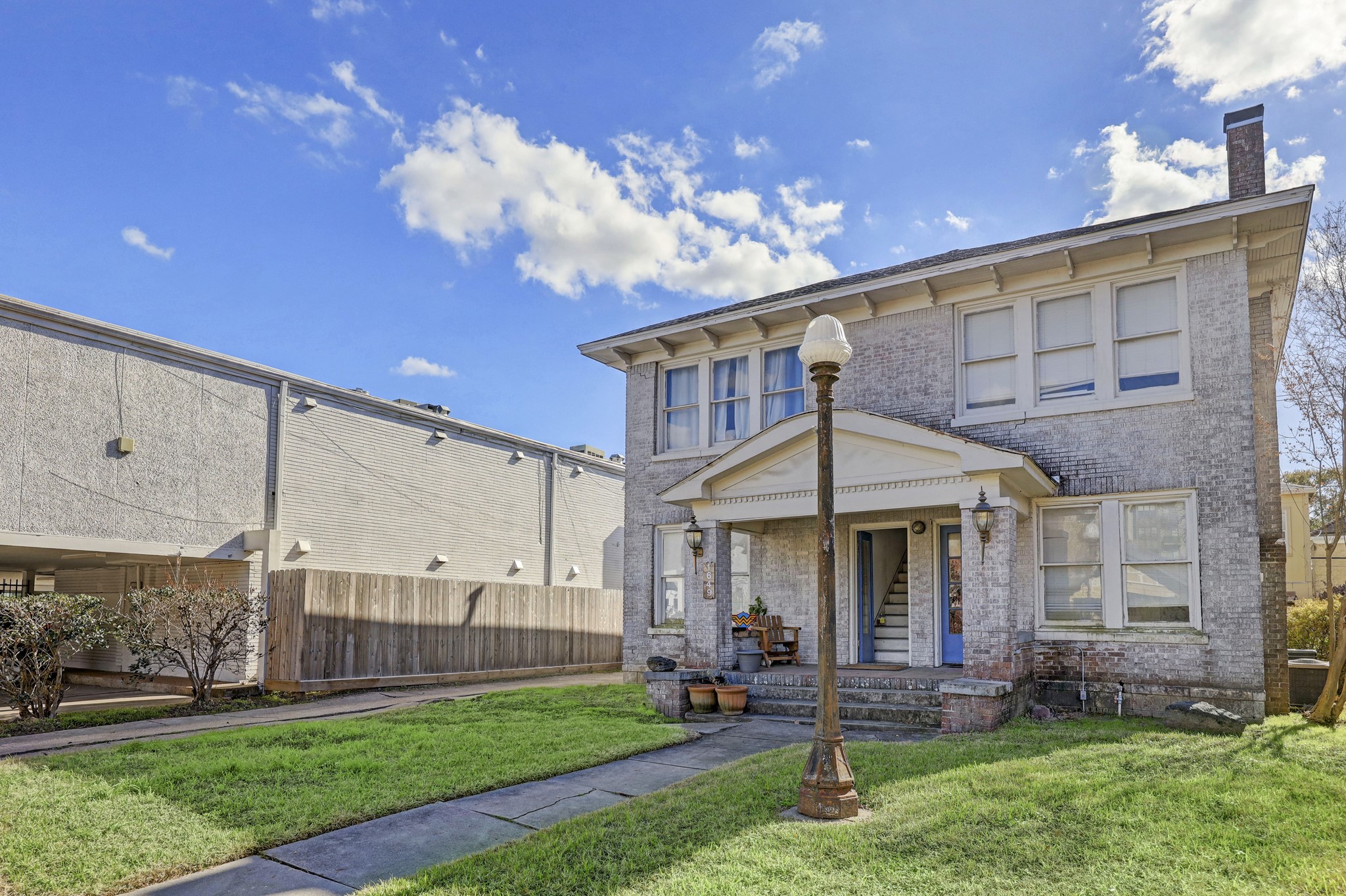 1649 West Main Street, Unit 3 Houston, TX 77006 - Photo 2 of 21 a front view of a house with a yard