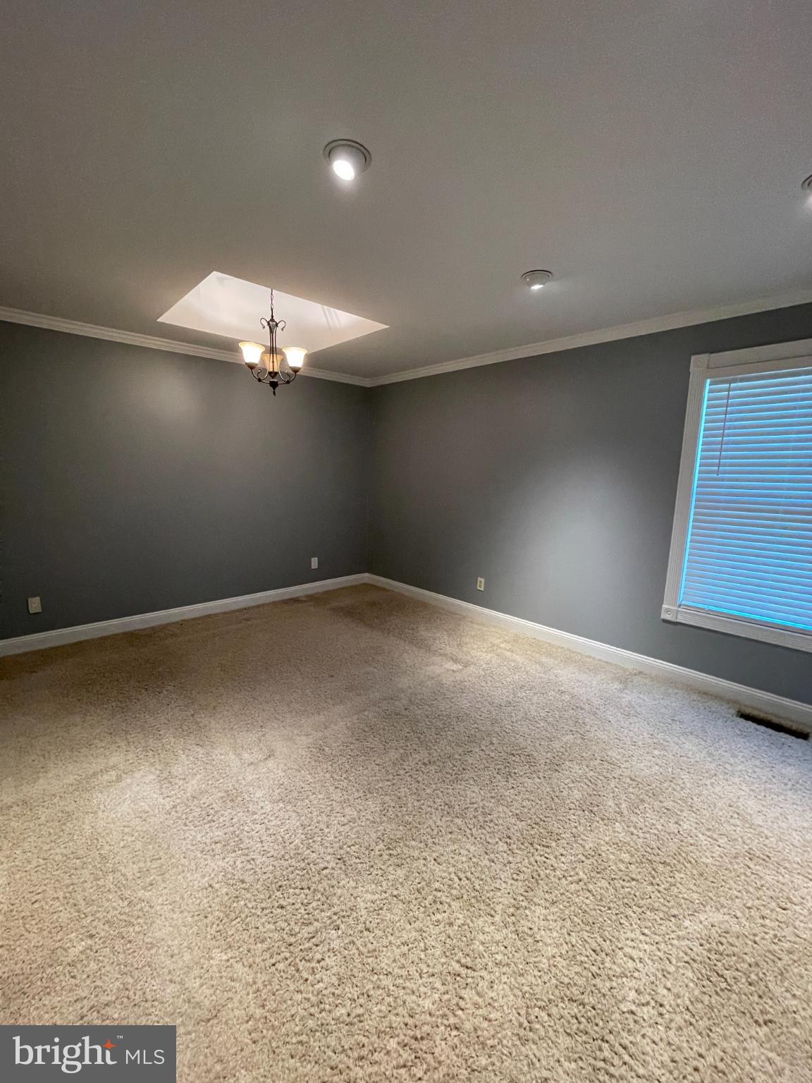 2883 Williamstown Road Franklinville, NJ 08322 - Photo 6 of 8 a view of an empty room with a chandelier fan