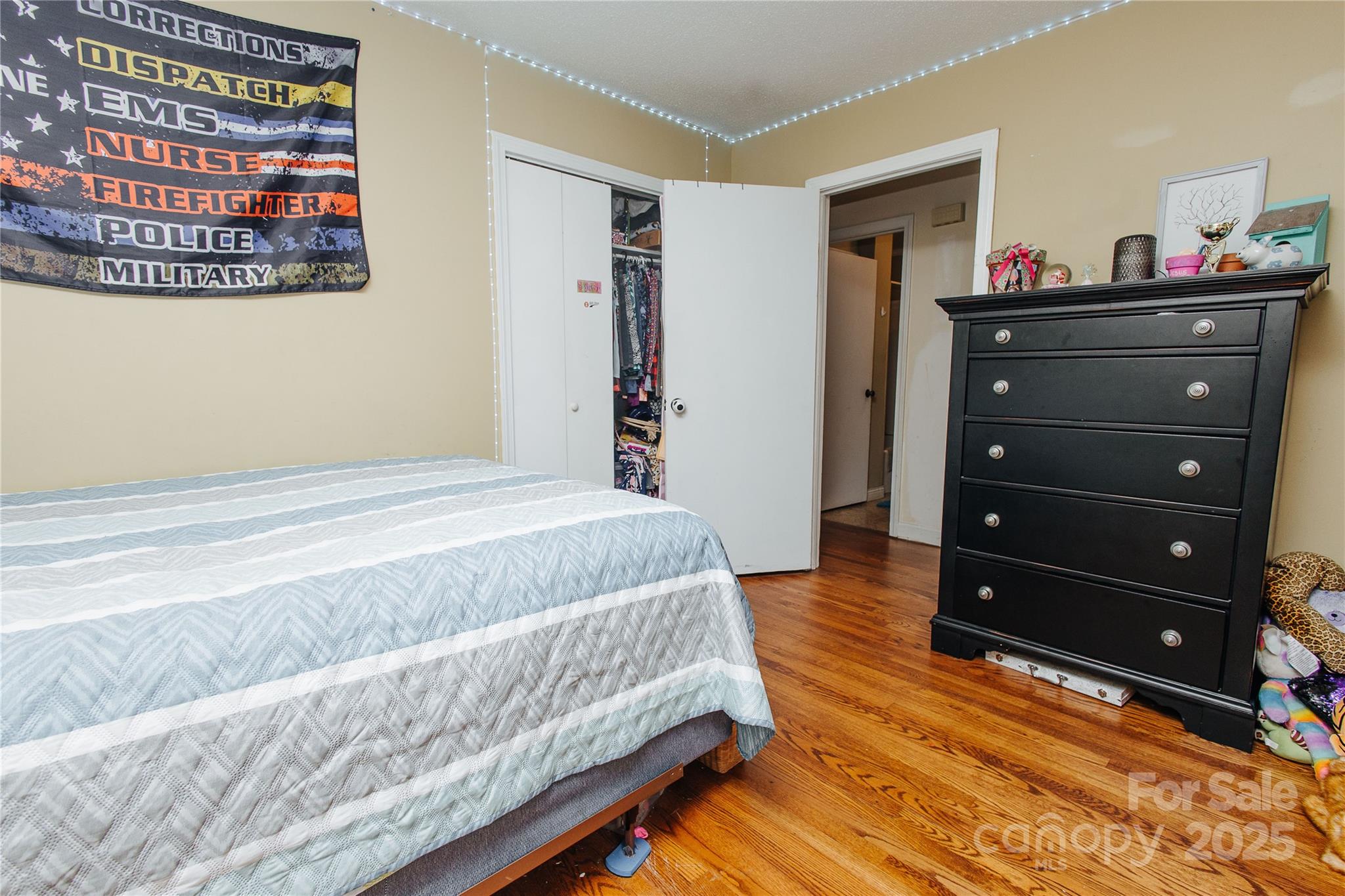 98 Long Street Marion, NC 28752 - Photo 14 of 30 a bedroom with a bed and a dresser