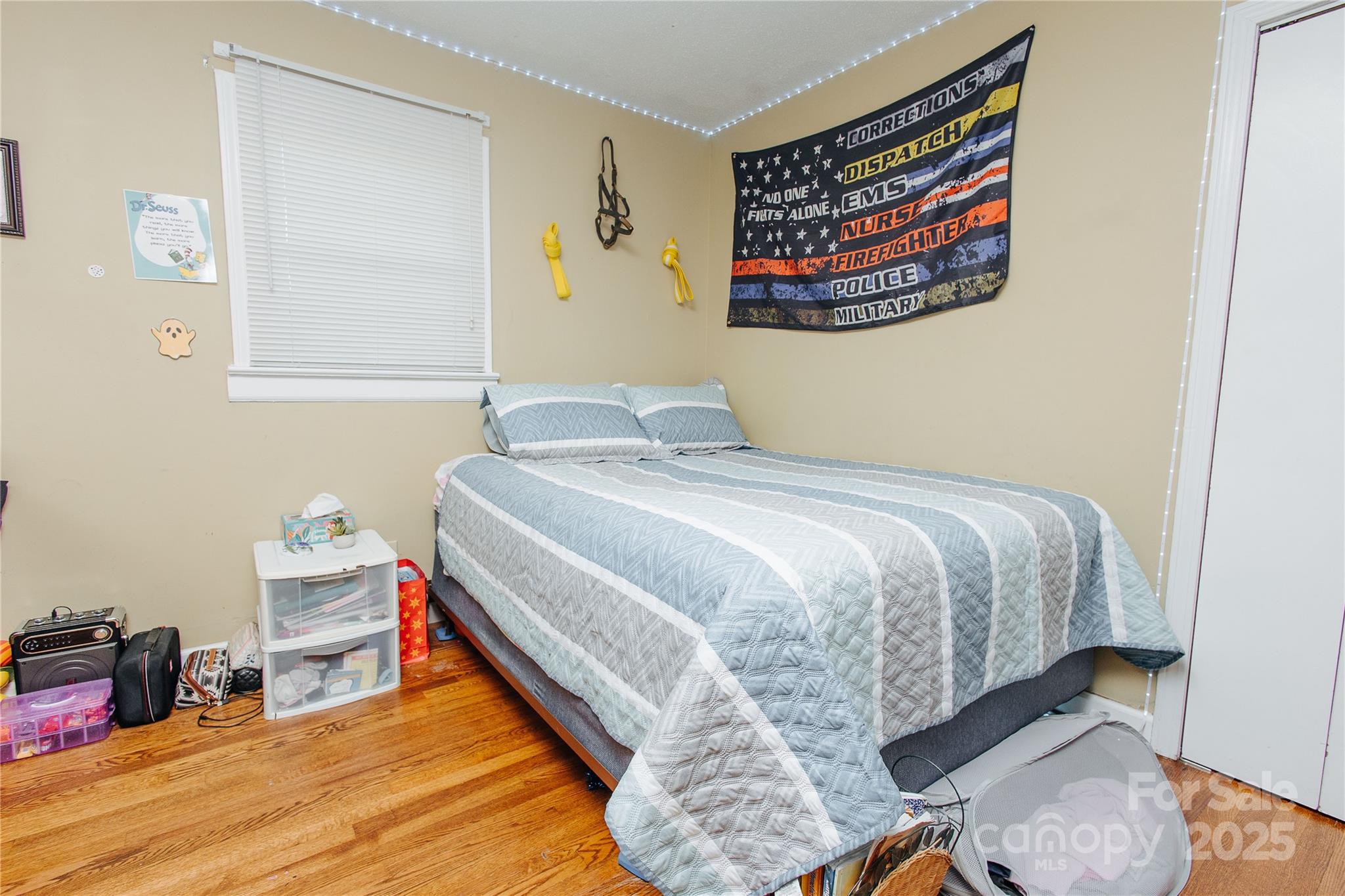 98 Long Street Marion, NC 28752 - Photo 15 of 30 a bedroom with a bed and painting on the wall