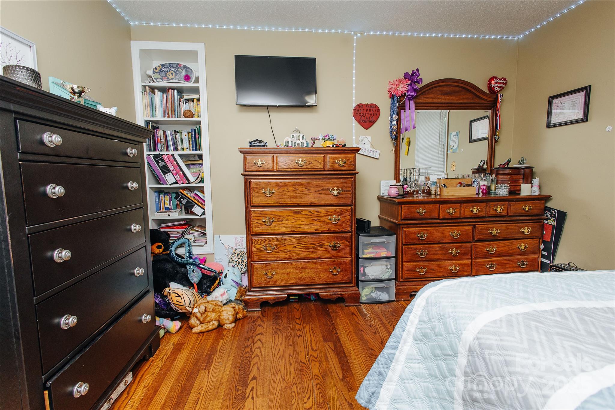 98 Long Street Marion, NC 28752 - Photo 16 of 30 a bedroom with a bed and wooden floor