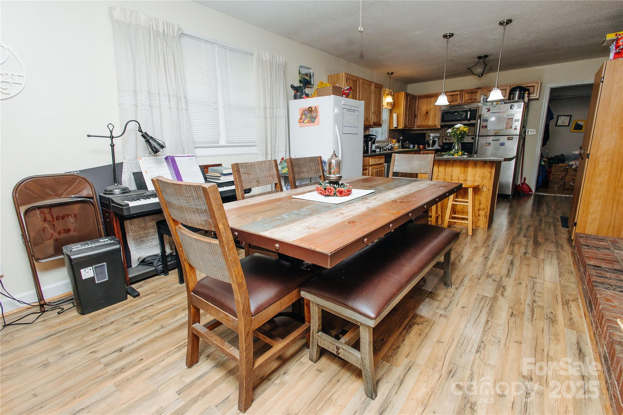 98 Long Street Marion, NC 28752 - Photo 17 of 30 a view of a dining room with furniture and wooden floor