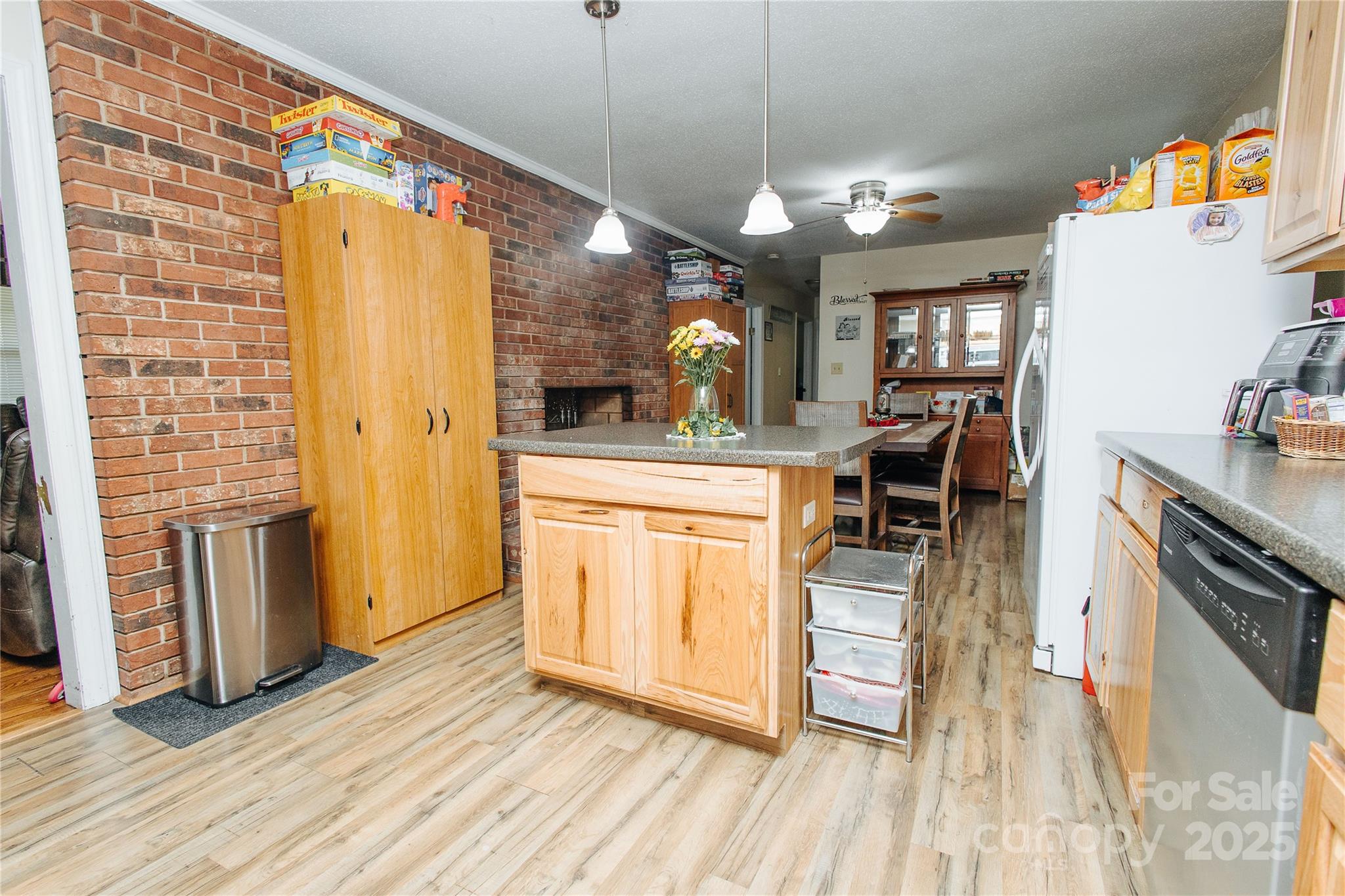 98 Long Street Marion, NC 28752 - Photo 24 of 30 a kitchen with stainless steel appliances granite countertop a refrigerator a oven a stove and a wooden floors