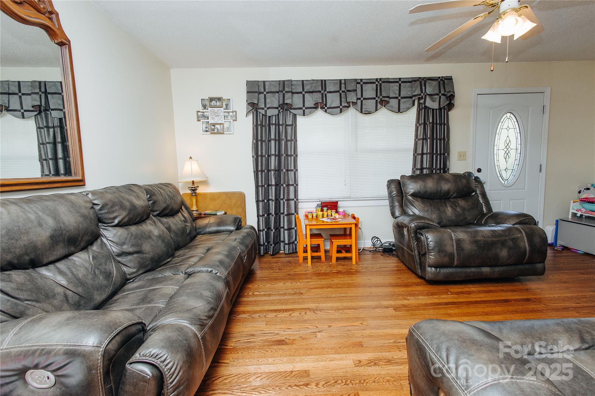 98 Long Street Marion, NC 28752 - Photo 25 of 30 a living room with furniture and a couch