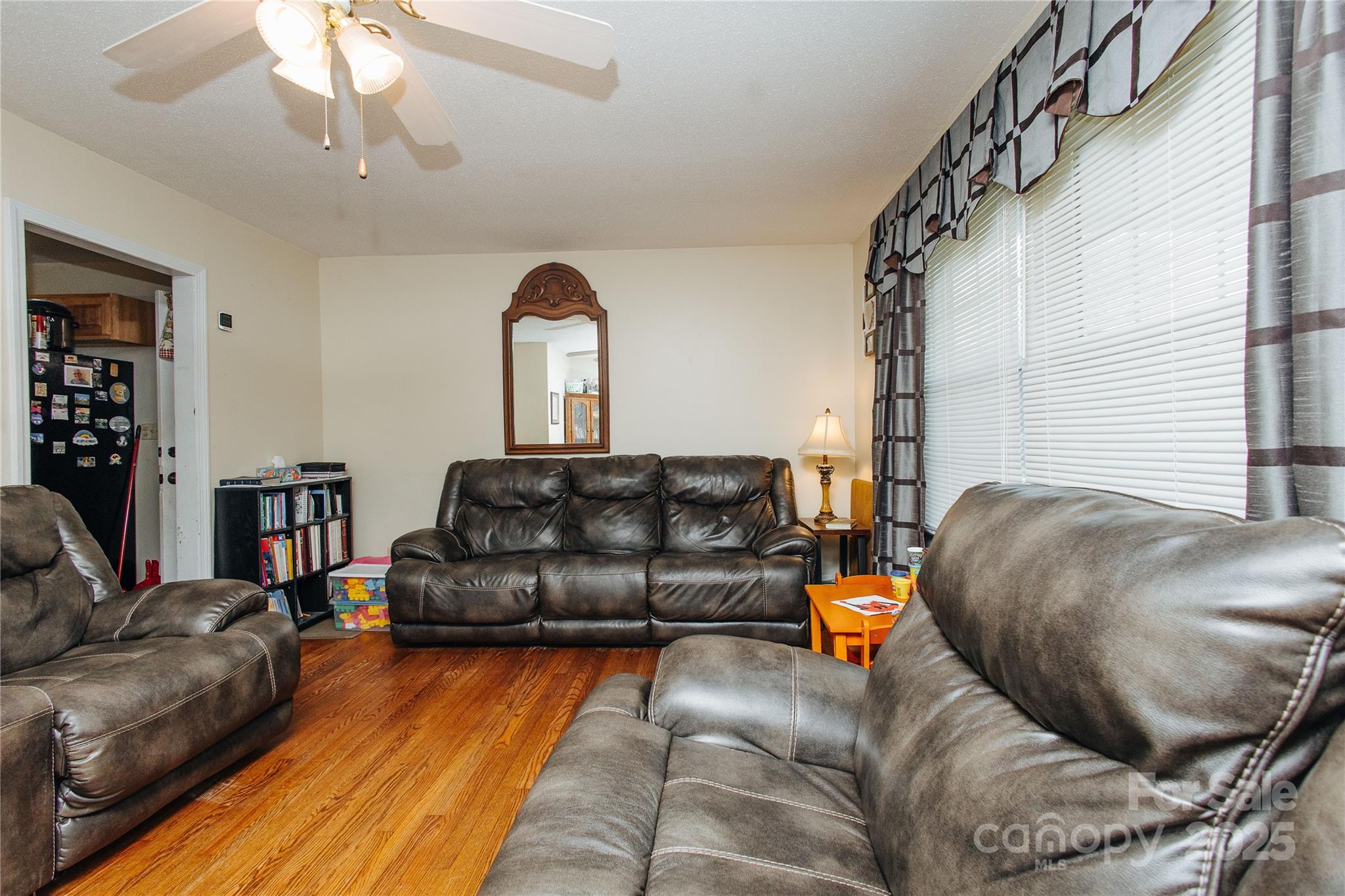 98 Long Street Marion, NC 28752 - Photo 28 of 30 a living room with furniture and a fireplace