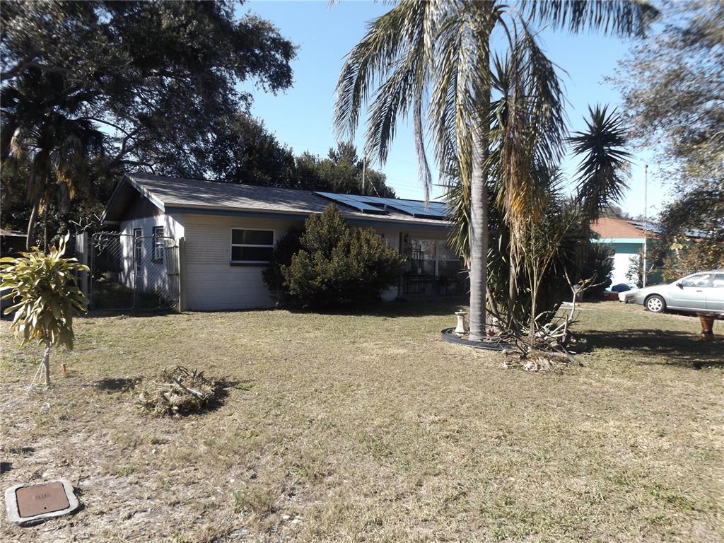 Front of the house with view of solar panels on top.