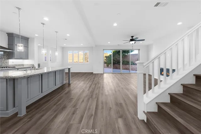 a kitchen with kitchen island a counter top space appliances and cabinets