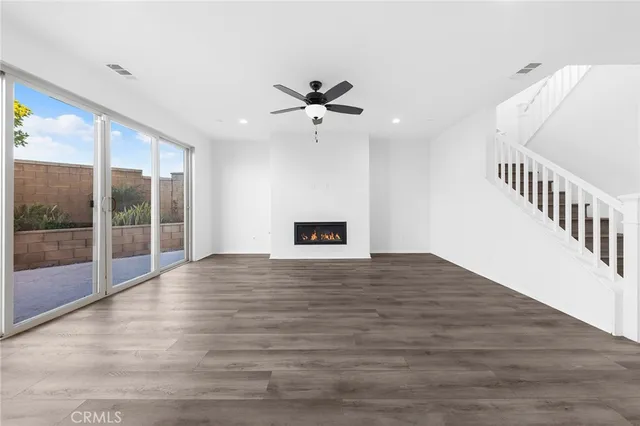 a large kitchen with granite countertop a lot of counter space
