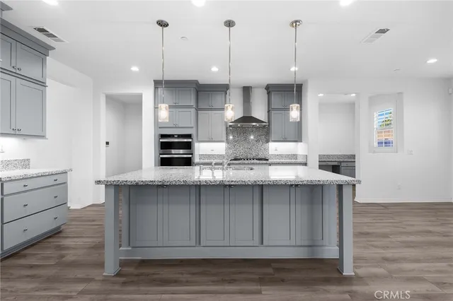 a view of a kitchen from the hallway