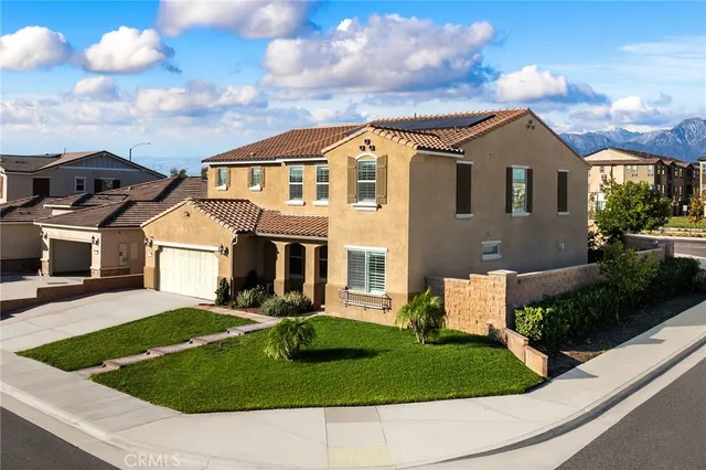 a view of house with yard and entertaining space